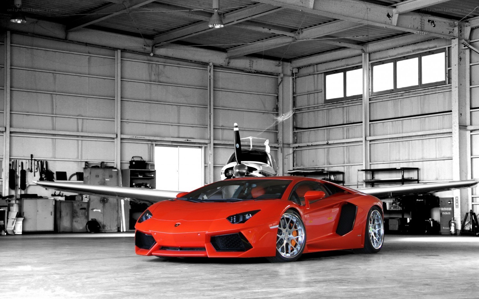 Red Lamborghini in hangar