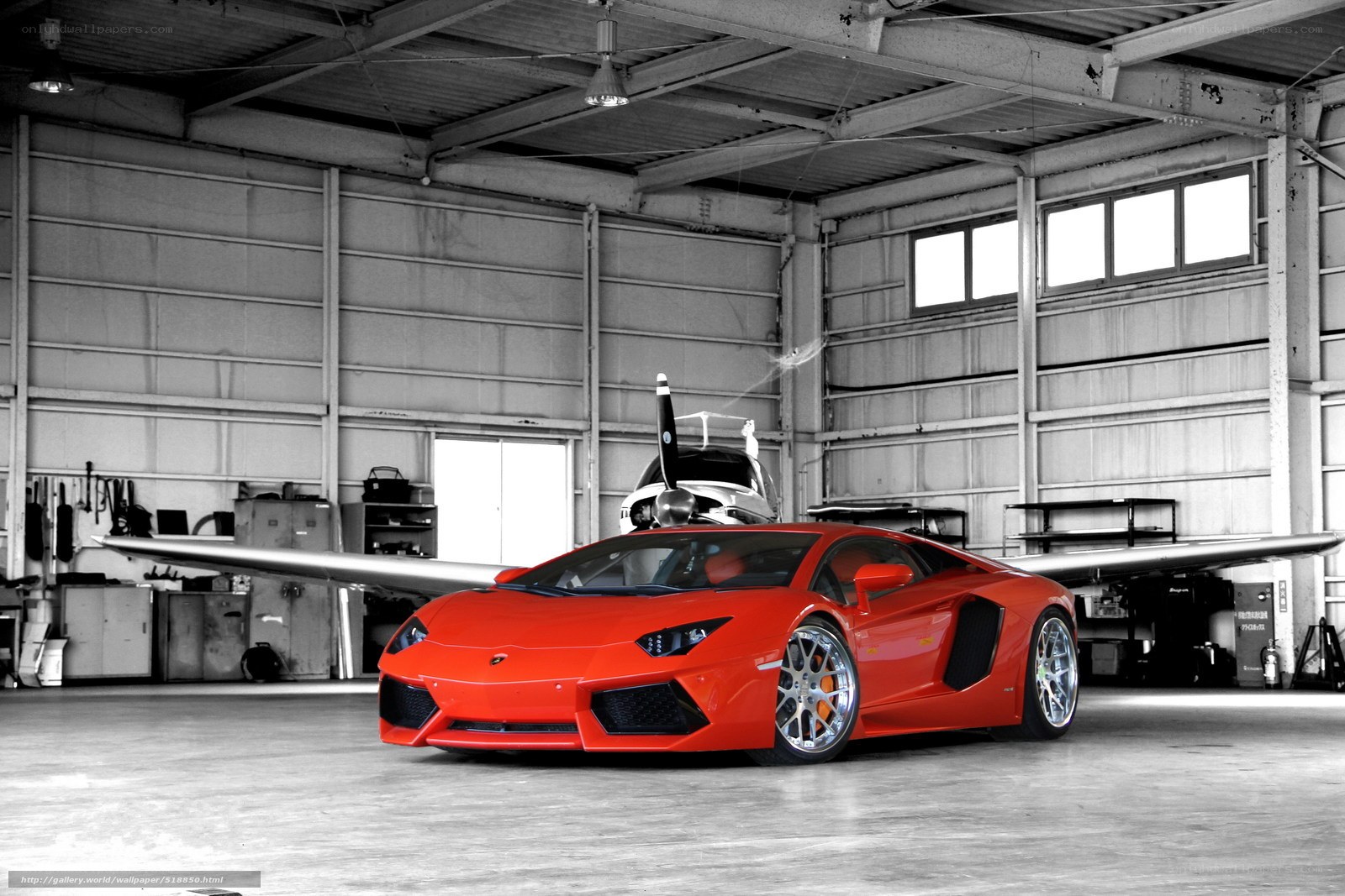 Red Lamborghini in hangar