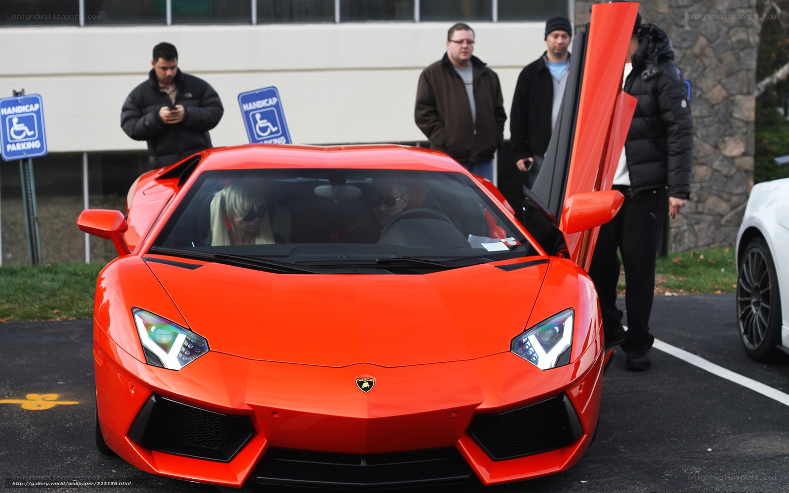 Red Lamborghini in parking lot