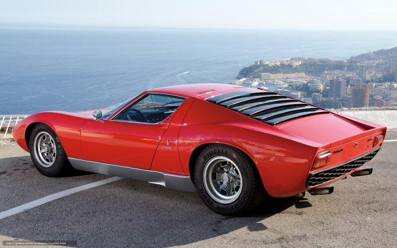 Red Lamborghini Miura by the coast