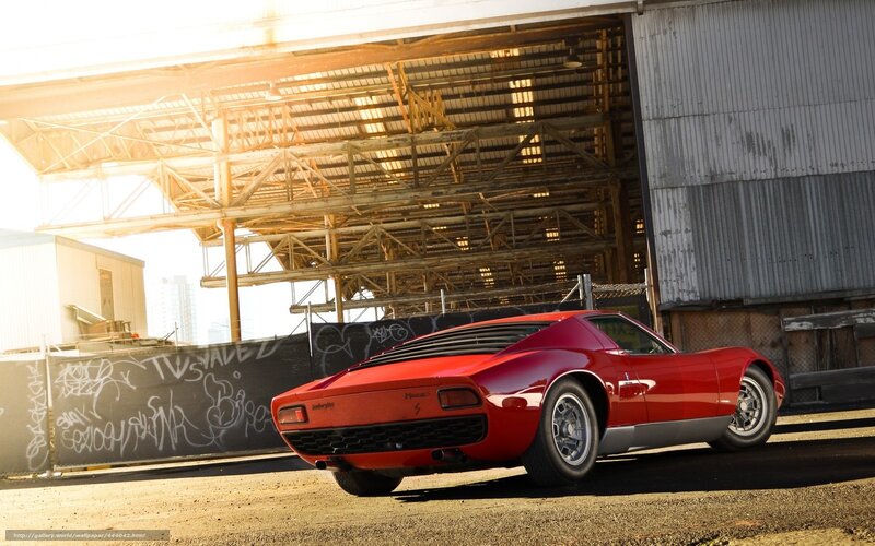 Red Lamborghini Miura in industrial setting