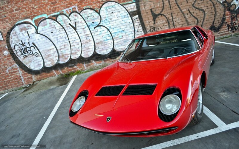 Red Lamborghini Miura in parking lot