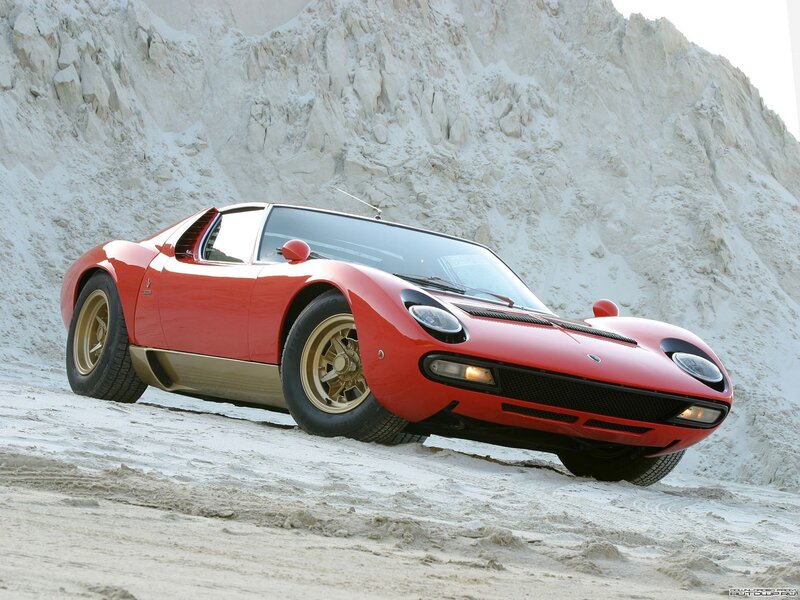 Red Lamborghini Miura on sand