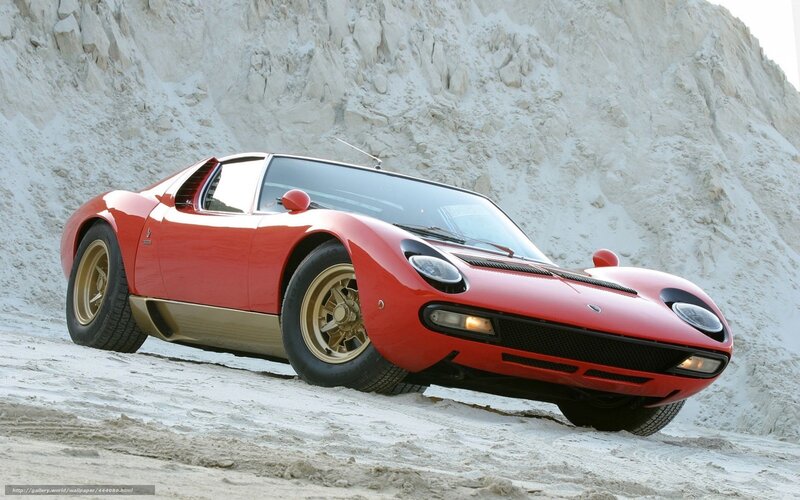 Red Lamborghini Miura on sand