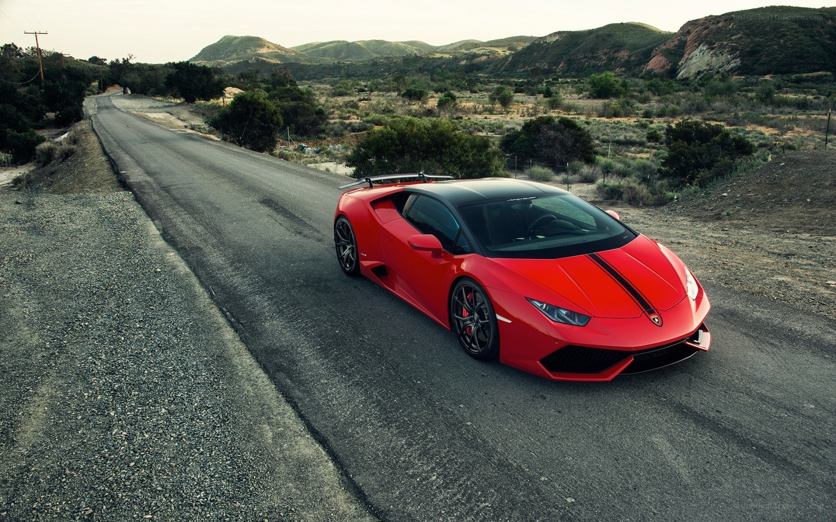 Red Lamborghini on a desert road