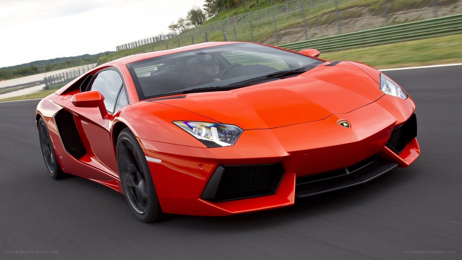 Red Lamborghini on a racetrack