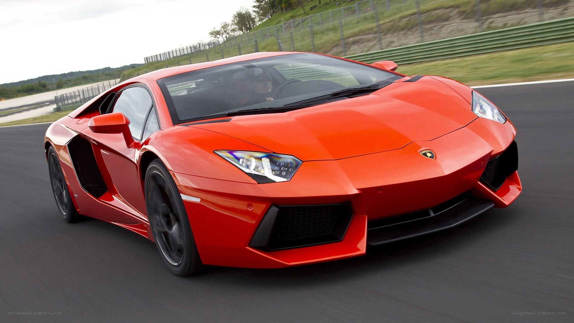 Red Lamborghini on a racetrack