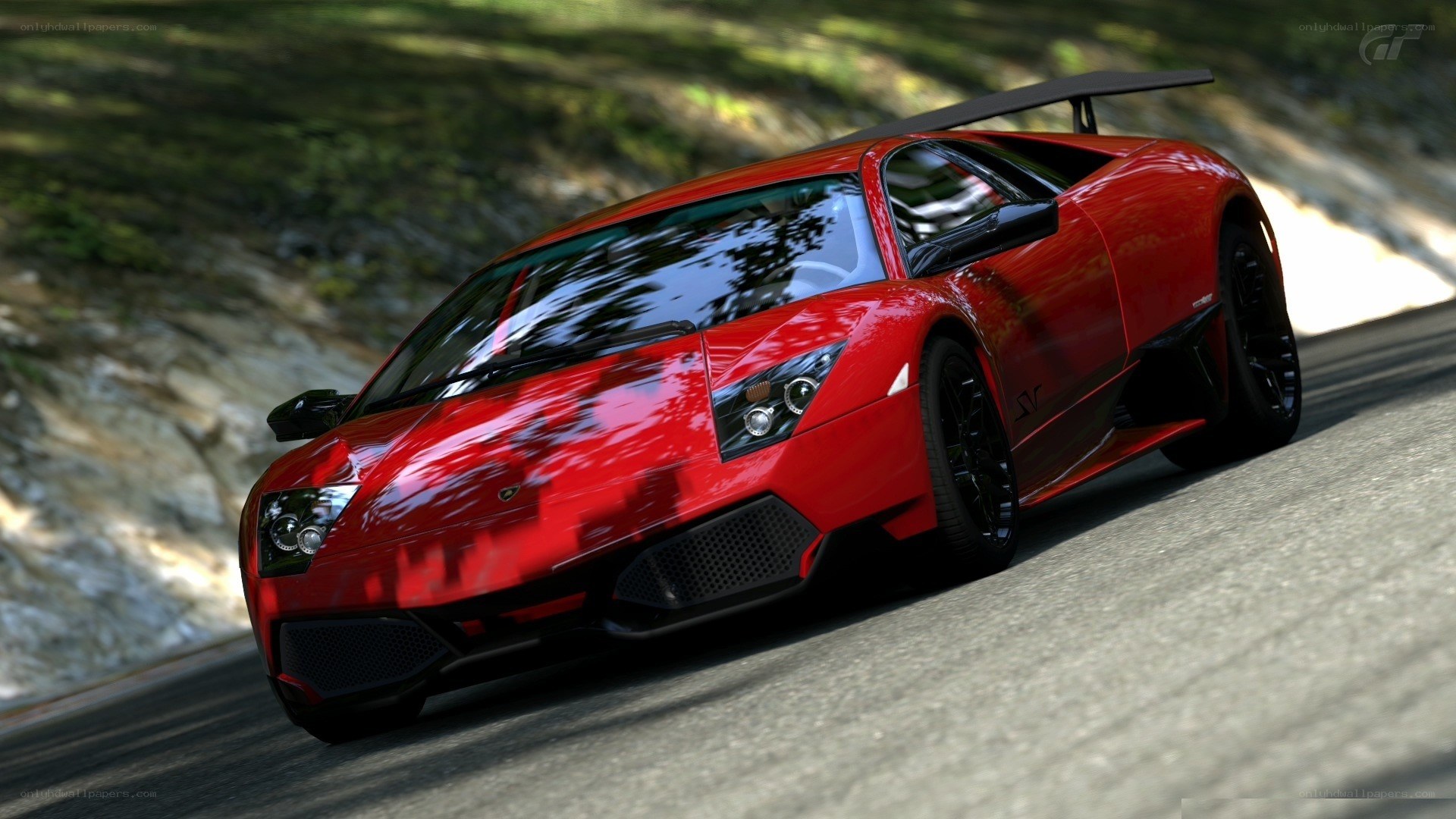 red lamborghini on a winding road