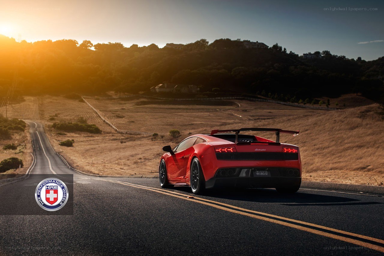Red Lamborghini on a winding road