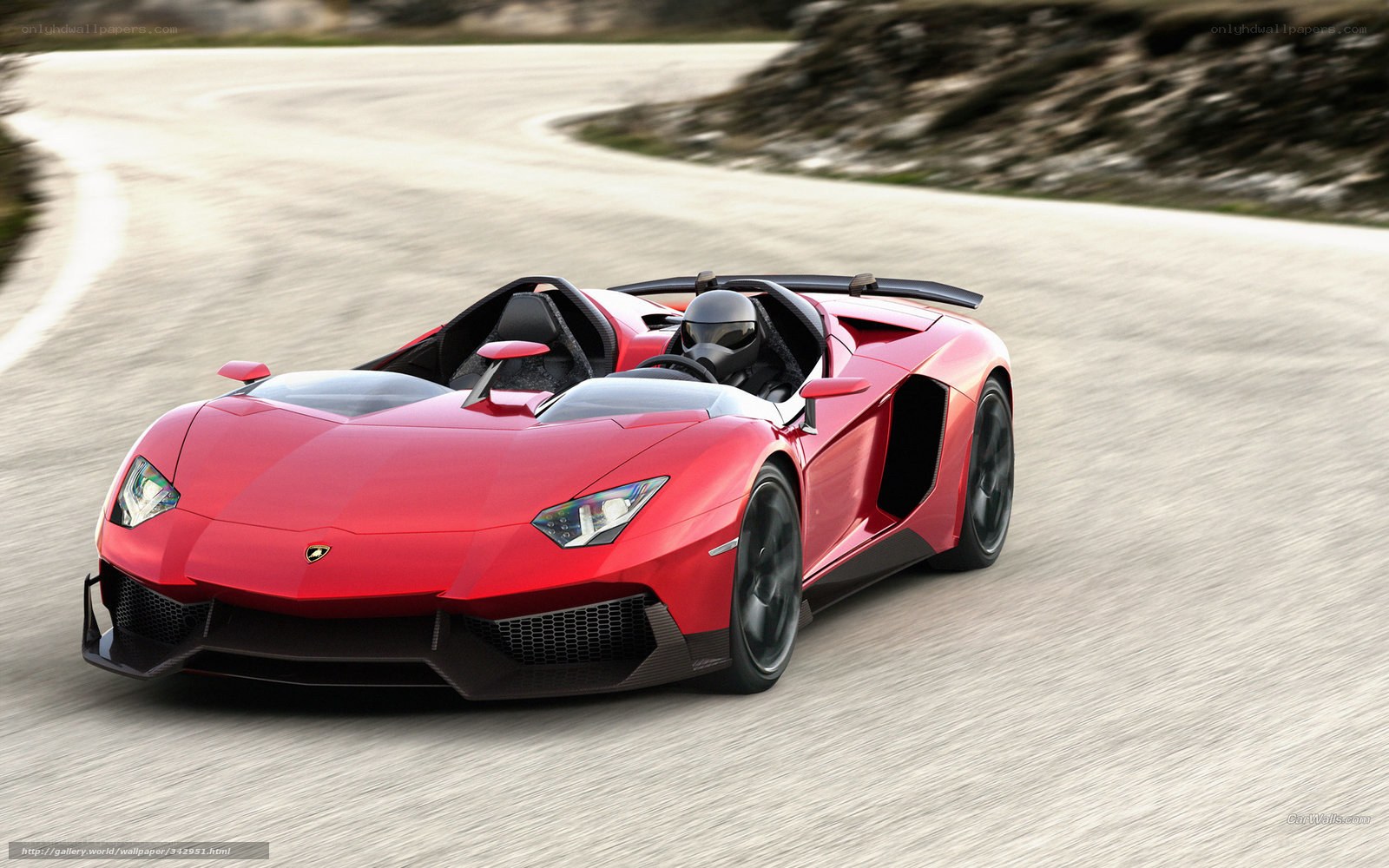 Red Lamborghini on a winding road