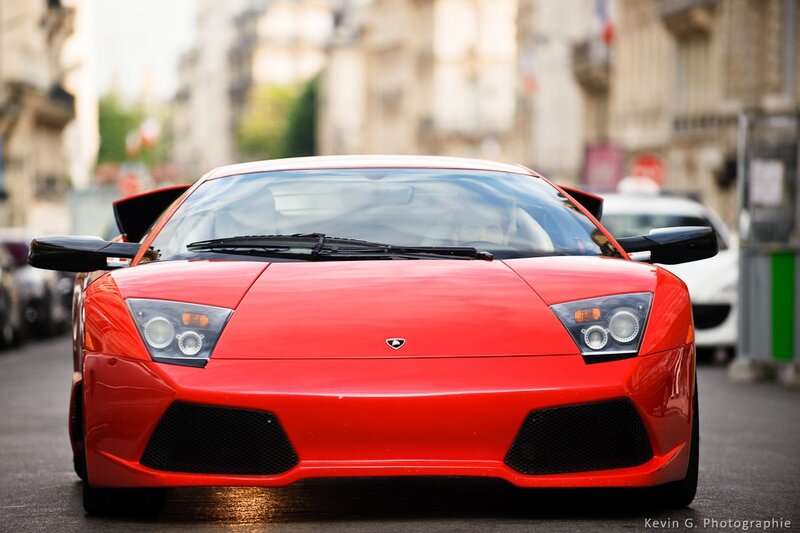 red lamborghini on city street