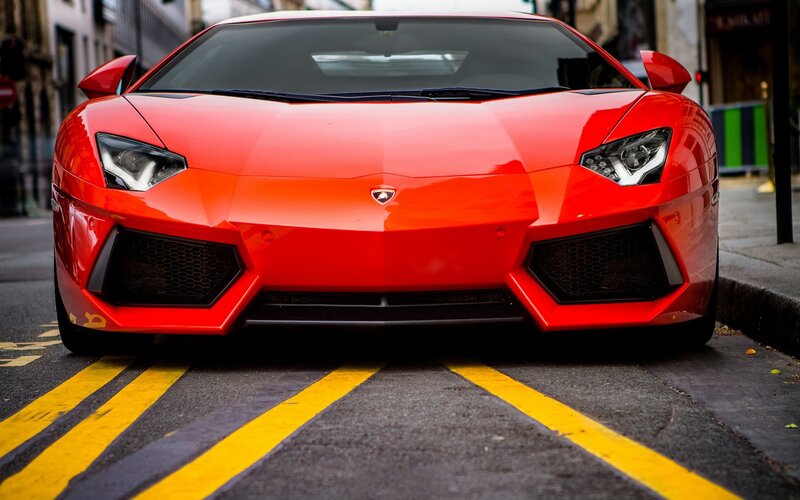 Red Lamborghini on city street