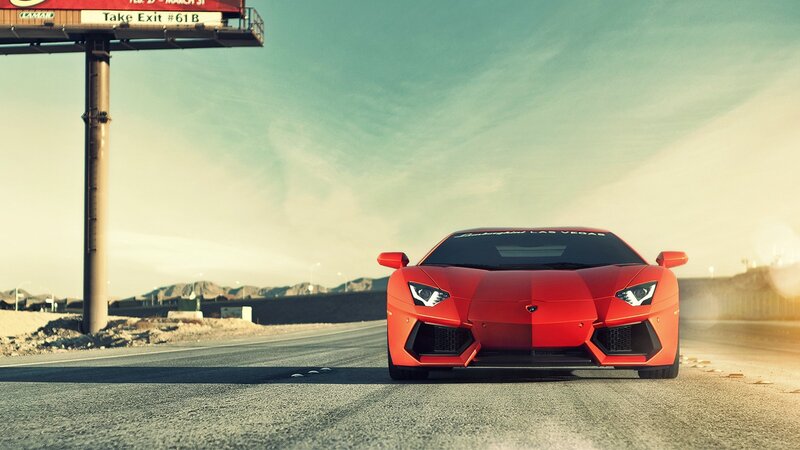 Red Lamborghini on desert road