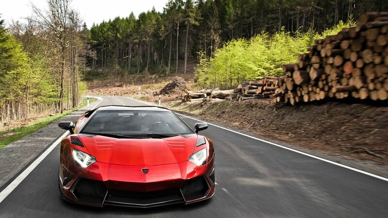 Red Lamborghini on forest road