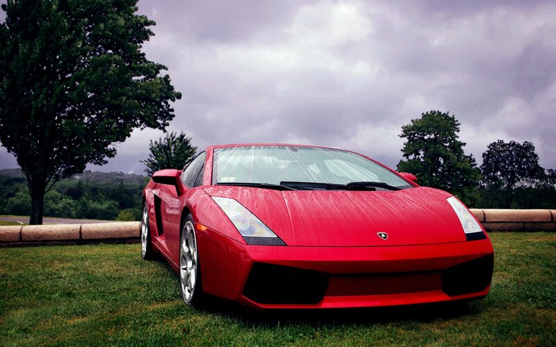 Red Lamborghini on Grass — Dramatic