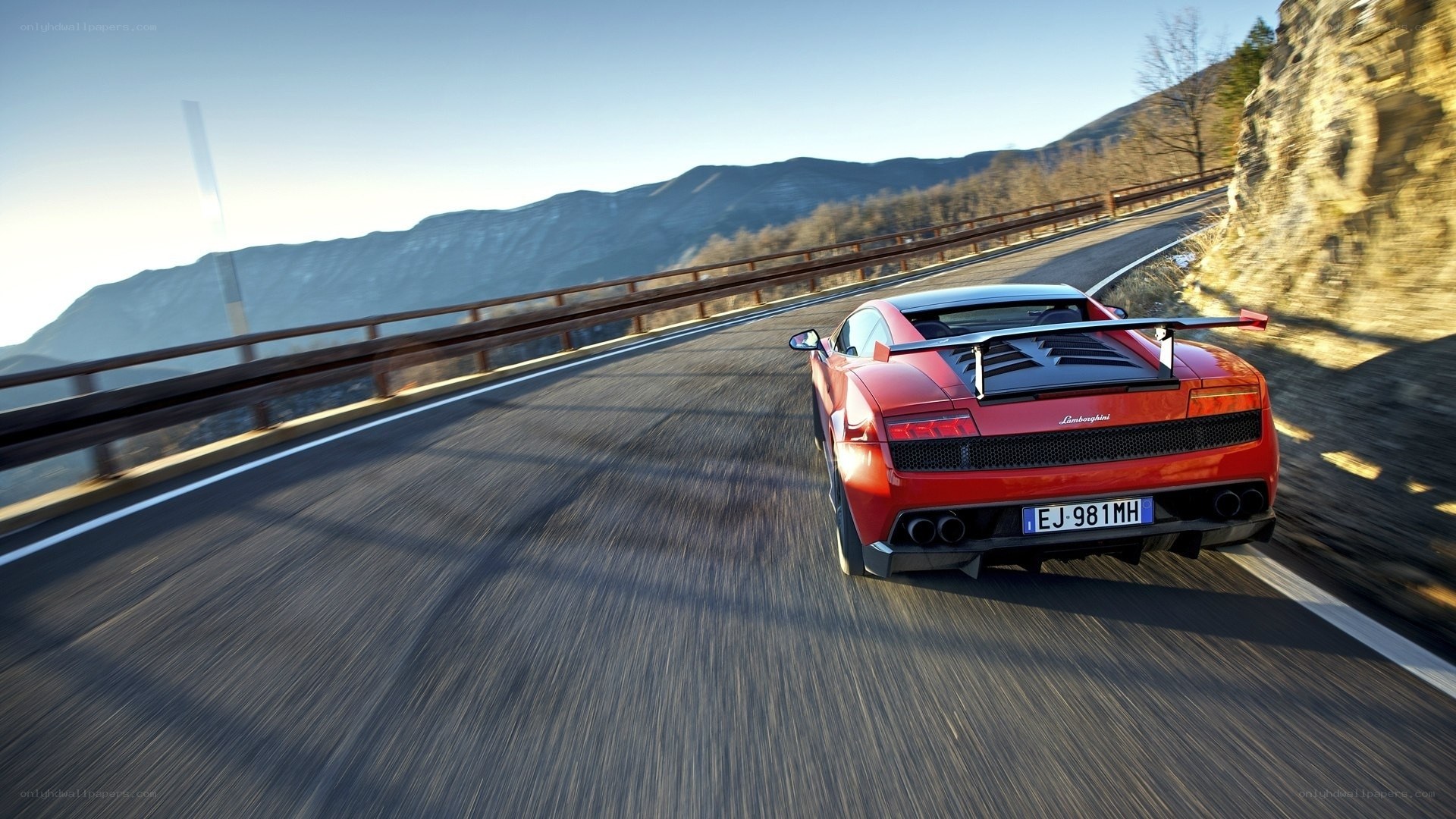 Red Lamborghini on mountain road