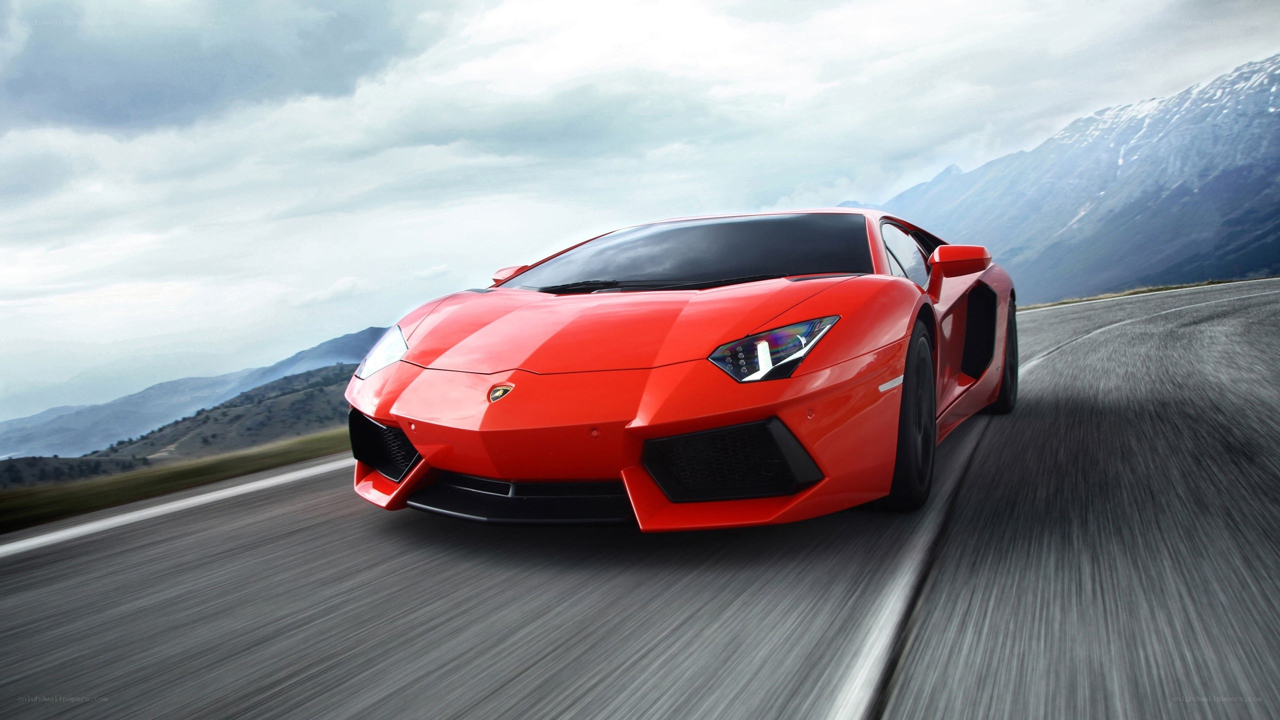 Red Lamborghini on mountain road