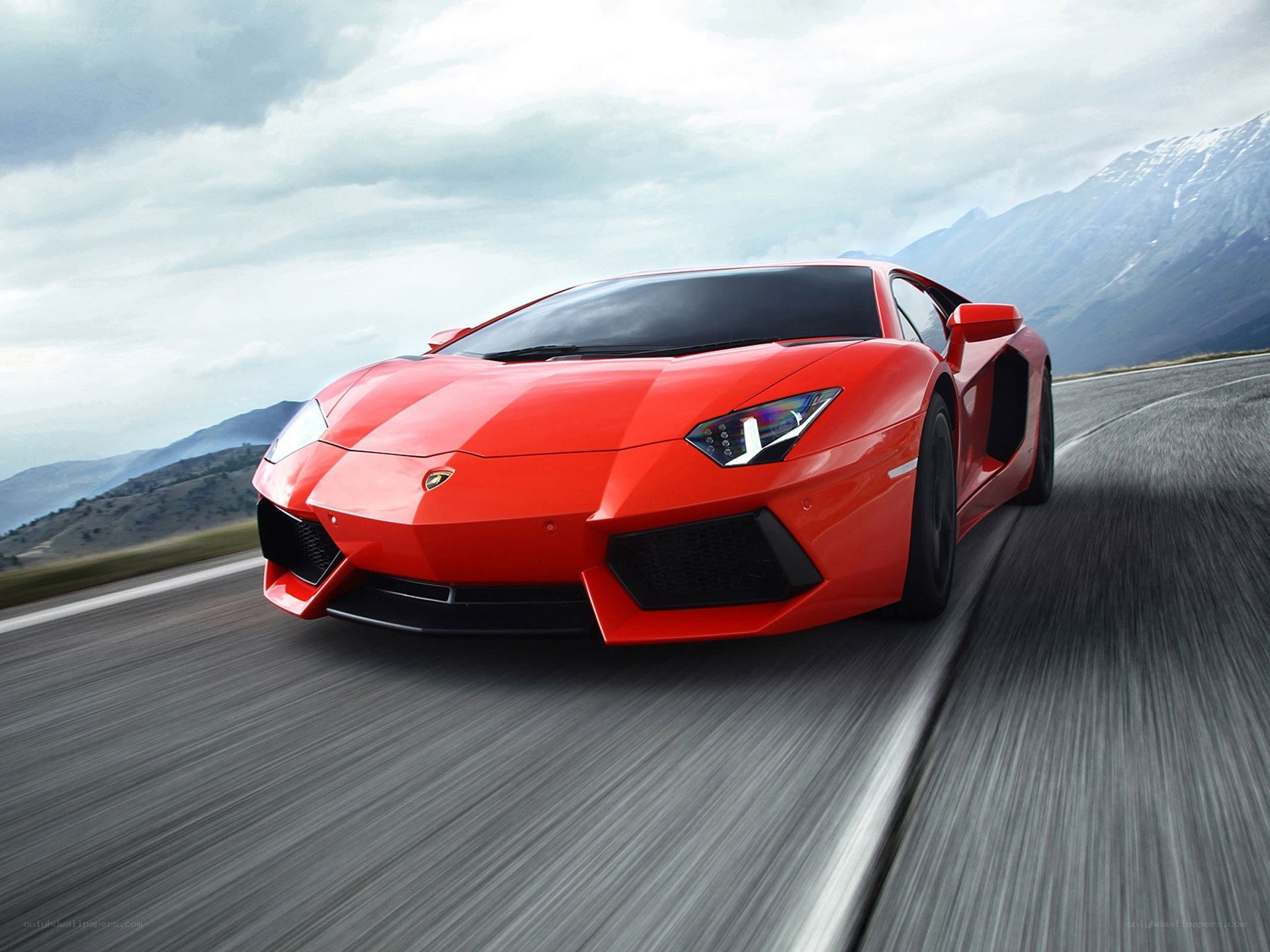 Red Lamborghini on mountain road