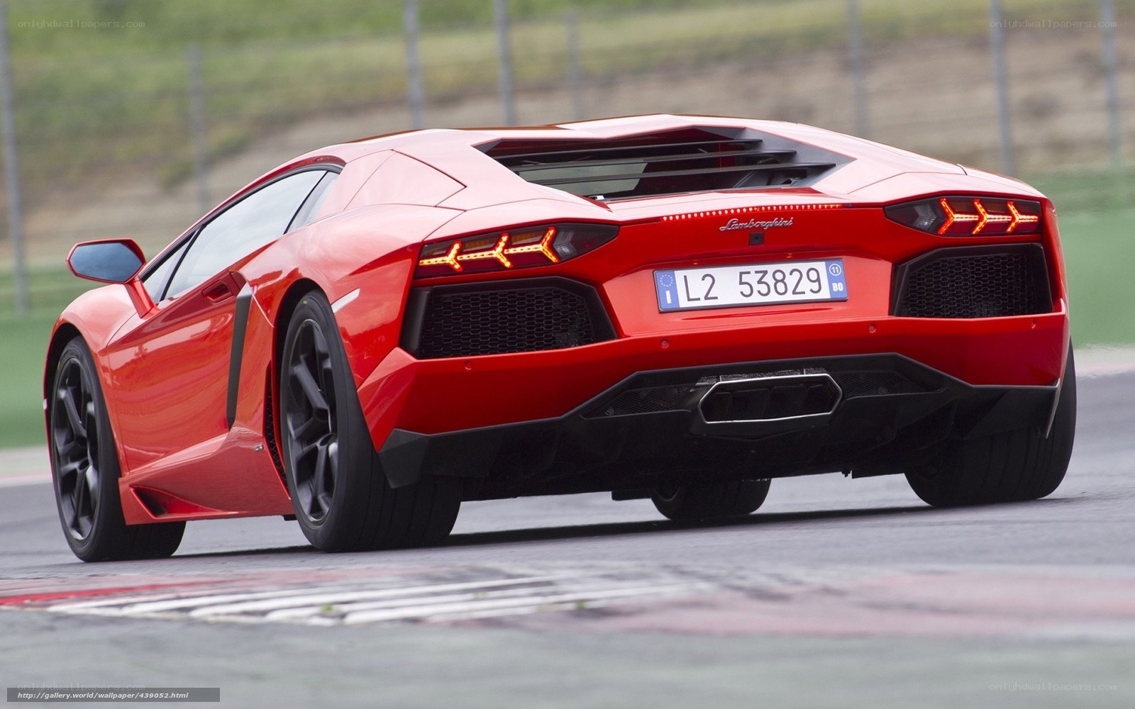 Red Lamborghini on racetrack