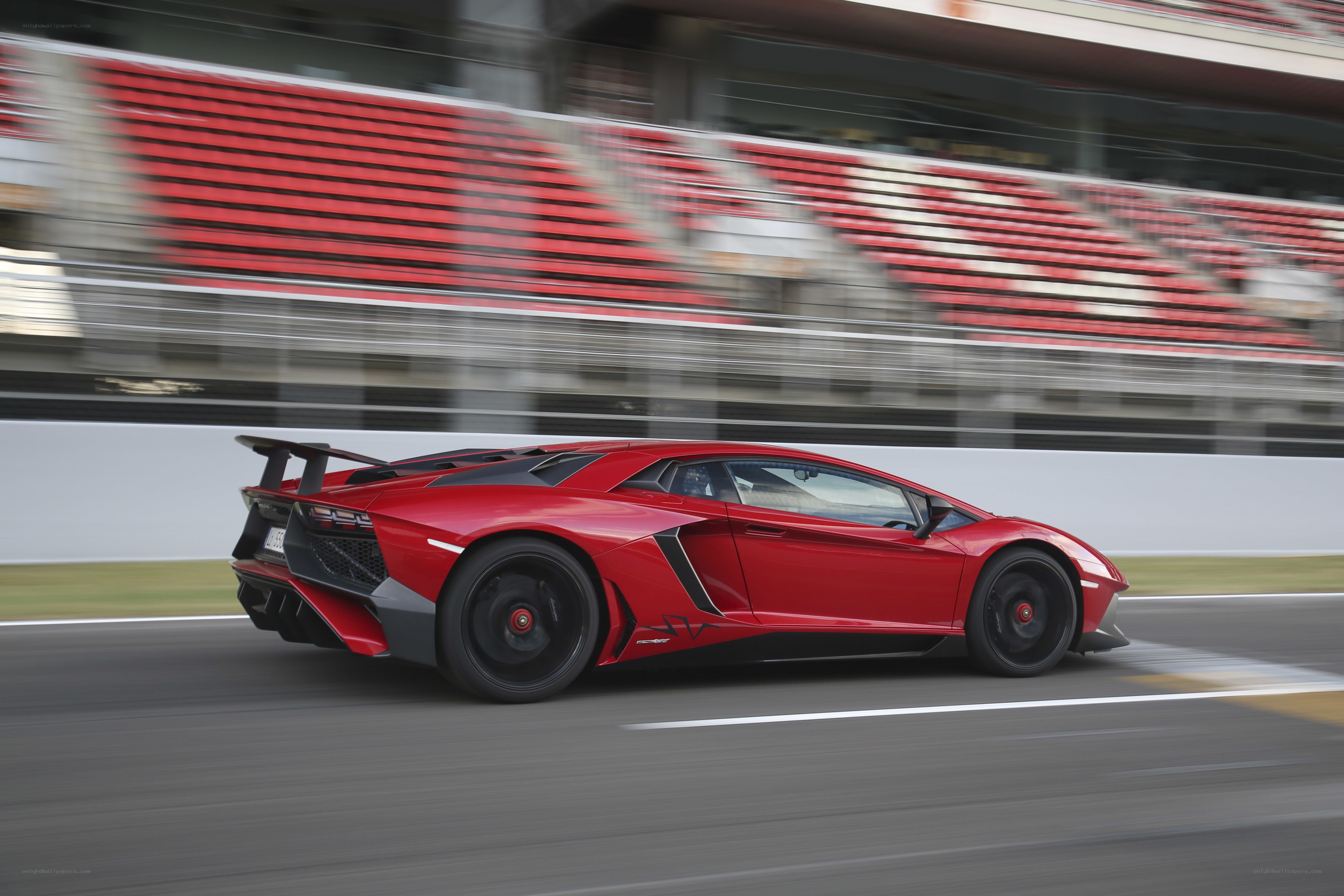 Red Lamborghini on racetrack