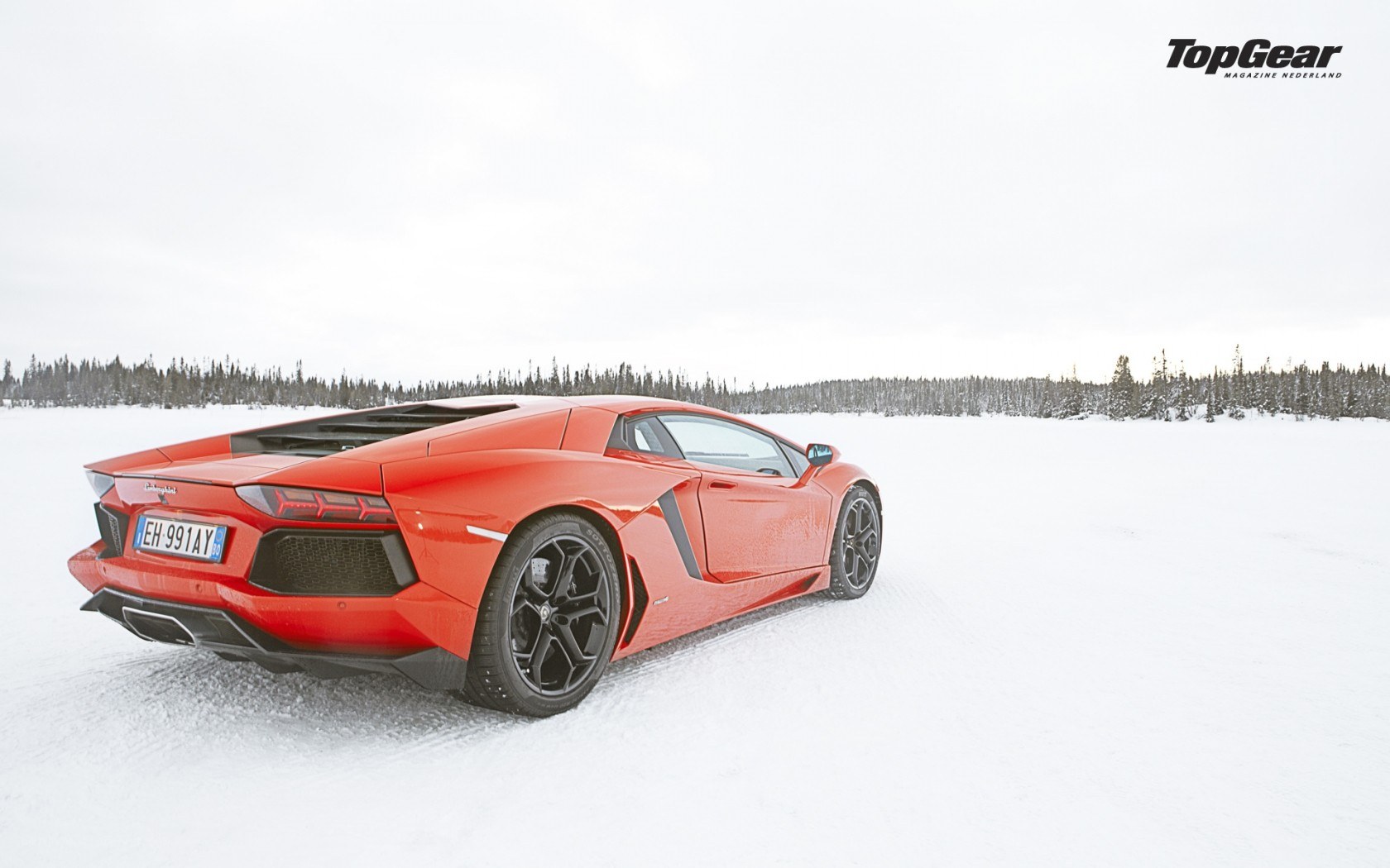 Red Lamborghini on snow