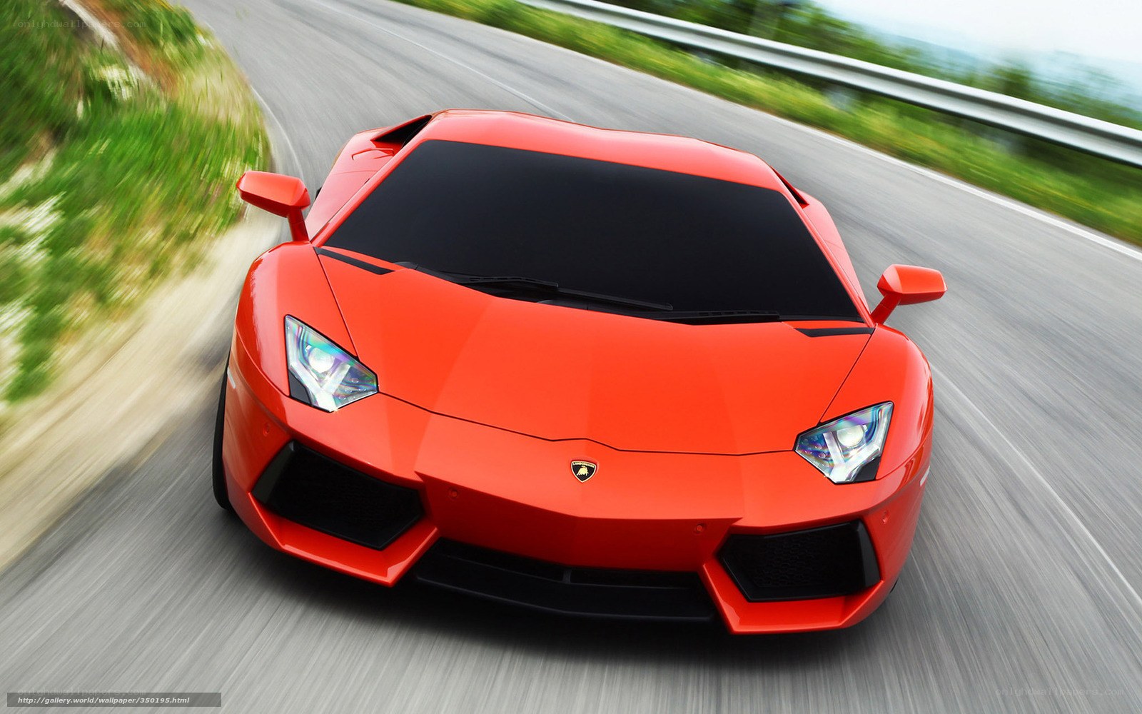 Red Lamborghini on winding road