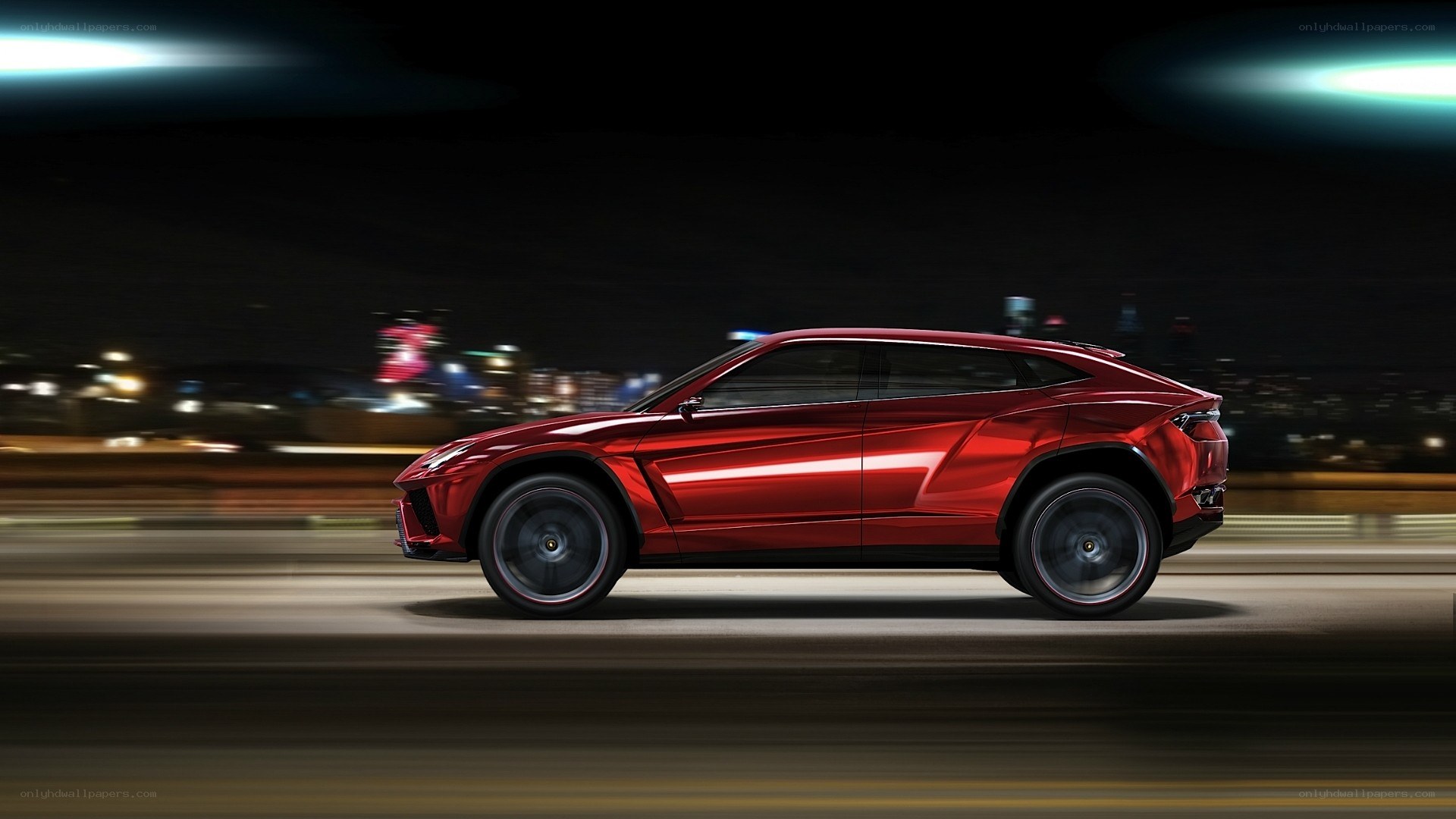 Red Lamborghini SUV at night