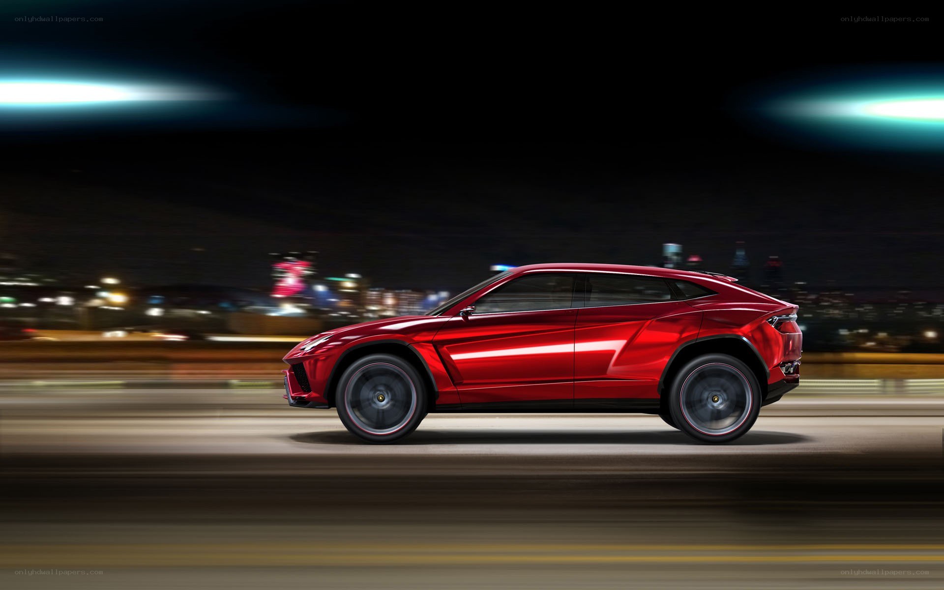 Red Lamborghini SUV at night