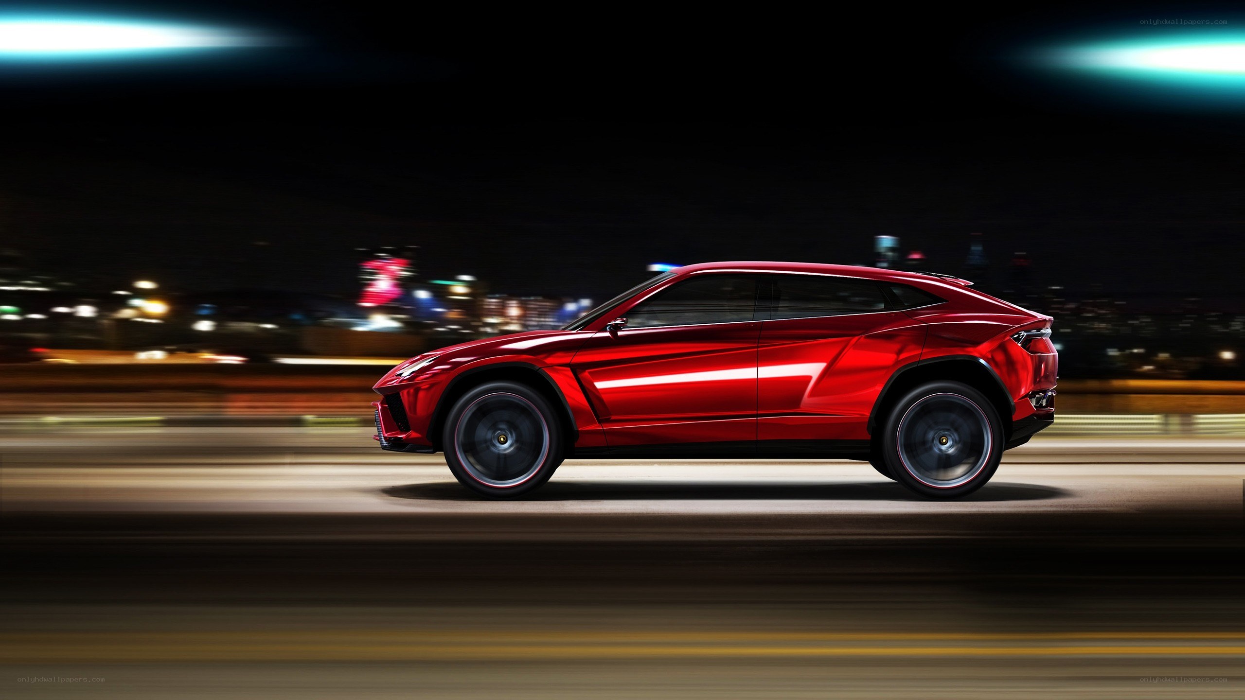 Red Lamborghini SUV at night
