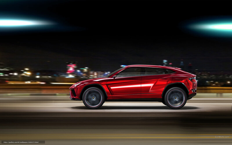 Red Lamborghini SUV at night
