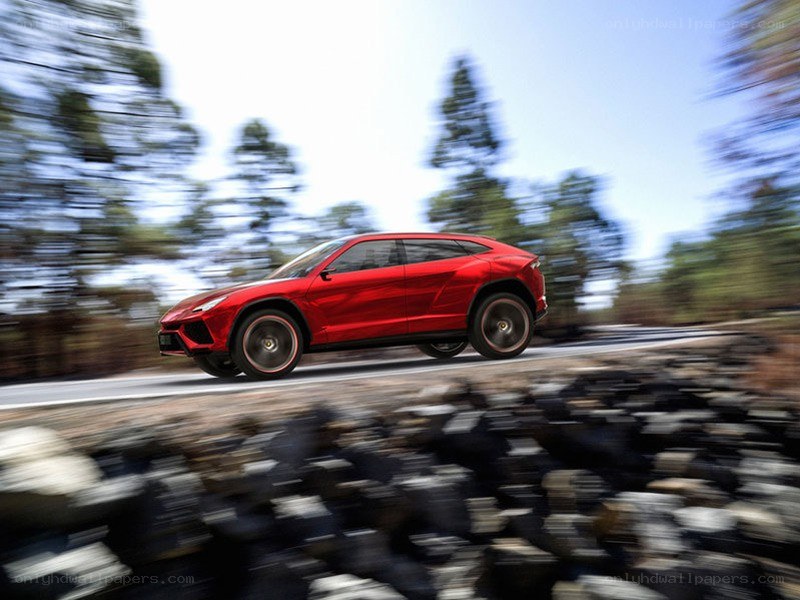 Red Lamborghini SUV in motion
