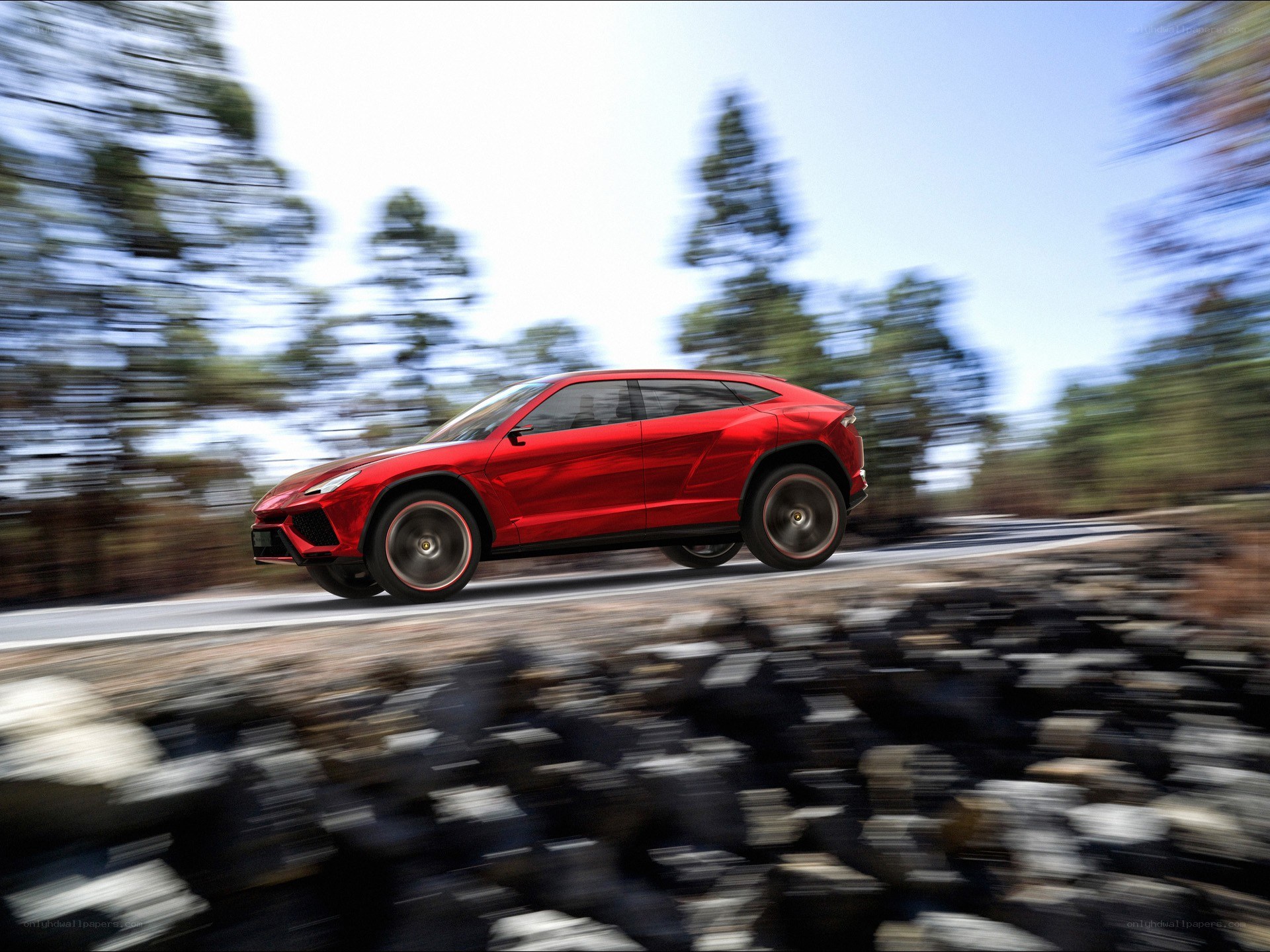 Red Lamborghini SUV in motion