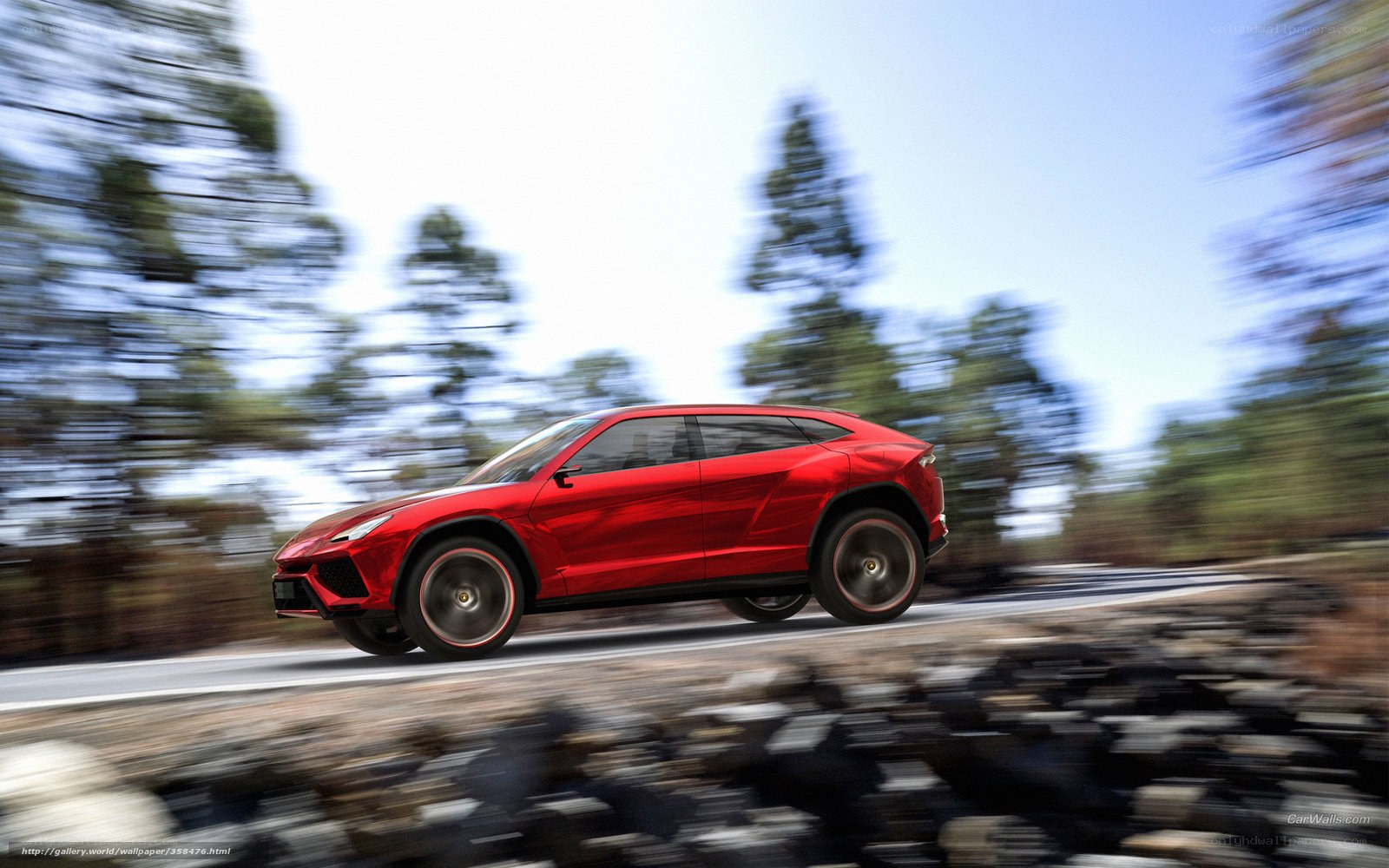 Red Lamborghini SUV in motion