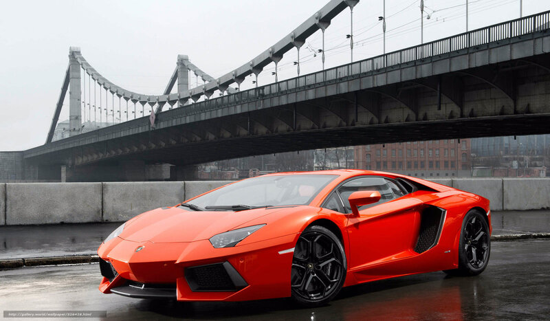 Red Lamborghini under a bridge