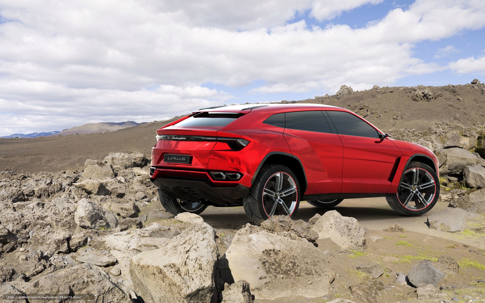 Red Lamborghini Urus in rocky landscape