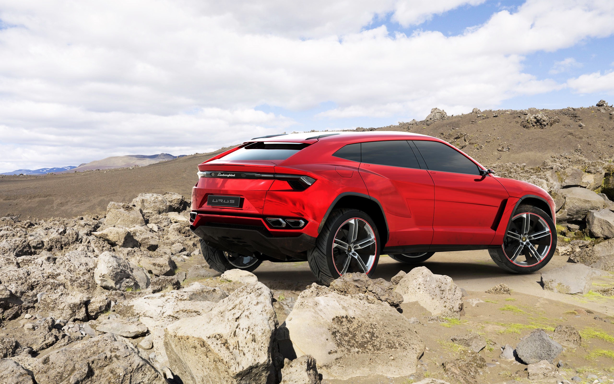 Red Lamborghini Urus in rugged terrain