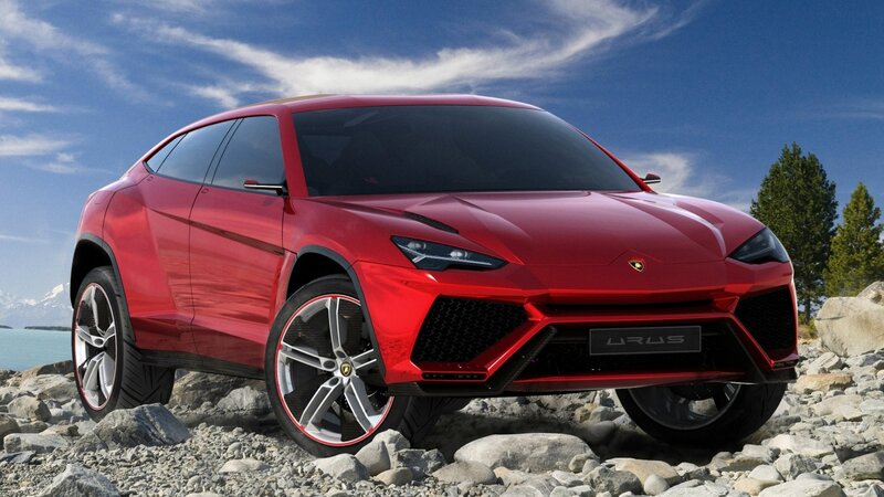 Red Lamborghini Urus on rocky shore