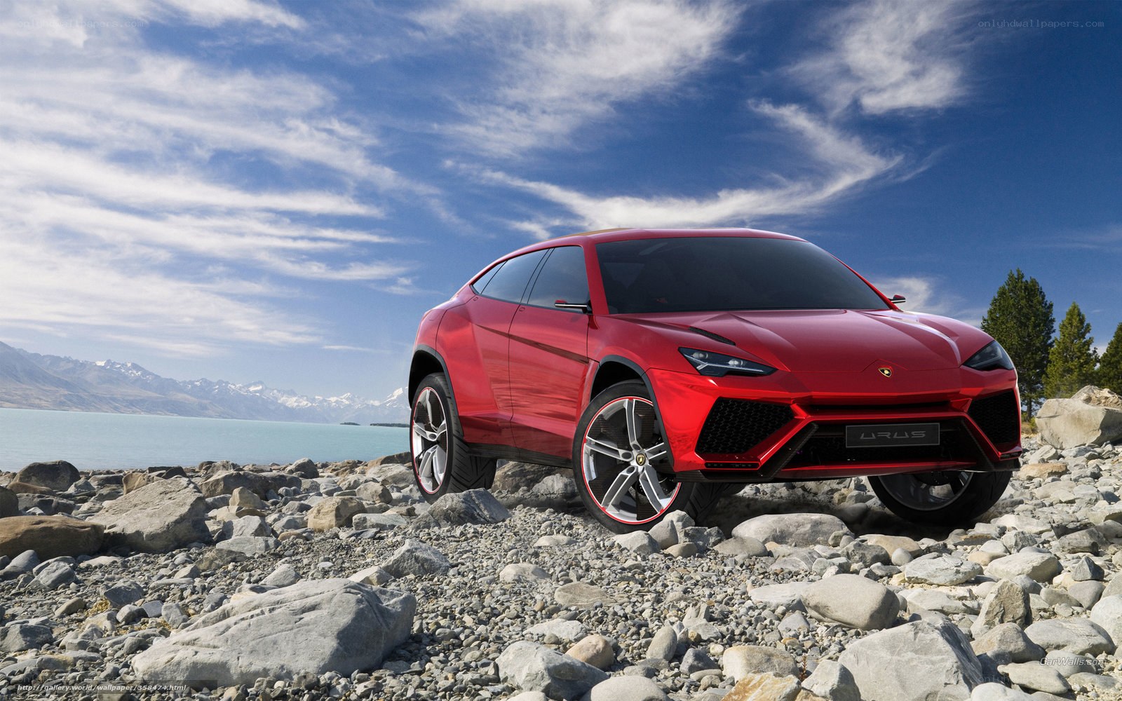 Red Lamborghini Urus on rocky shore
