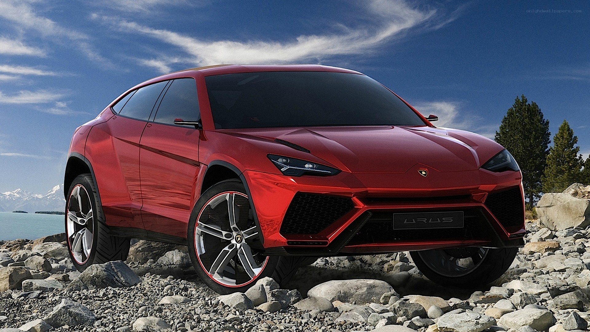Red Lamborghini Urus on rocky terrain