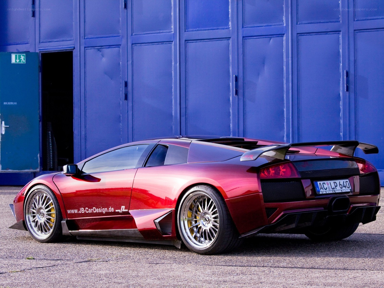 Red Lamborghini with custom wheels