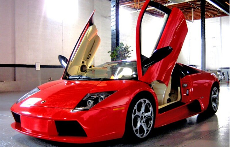 Red Lamborghini with doors open