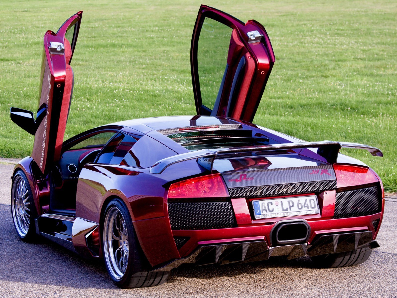 Red Lamborghini with doors open