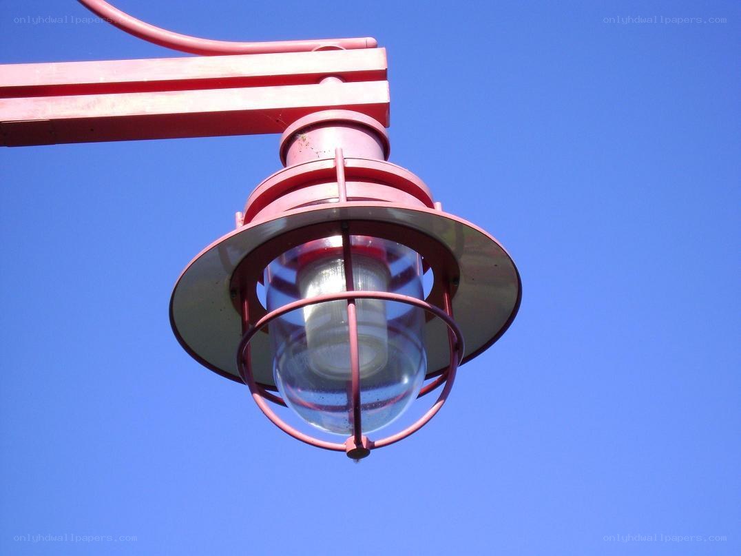red lamp against blue sky