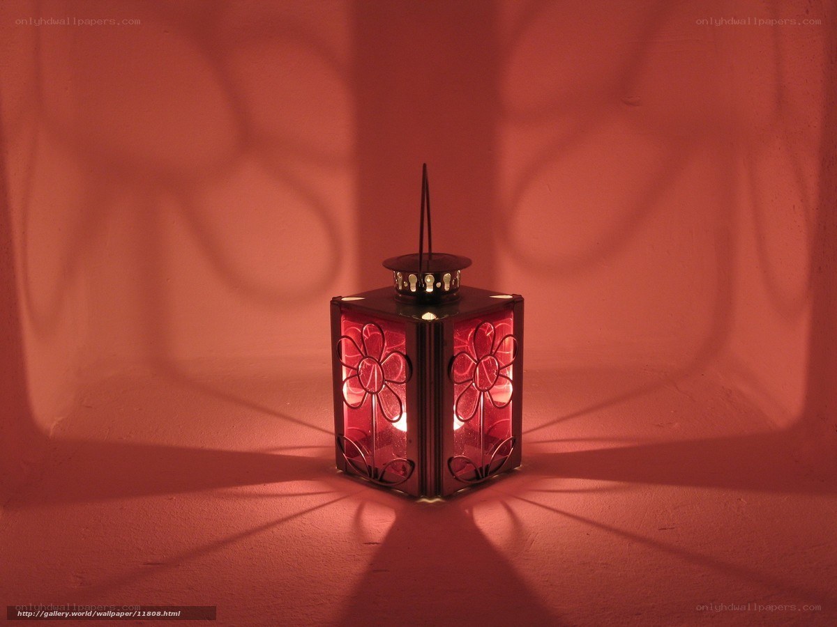 Red lantern casting floral shadows