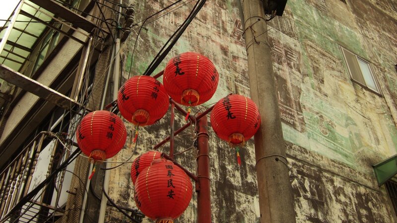 Red lanterns in an old alley