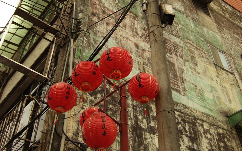 Red lanterns in an old alley