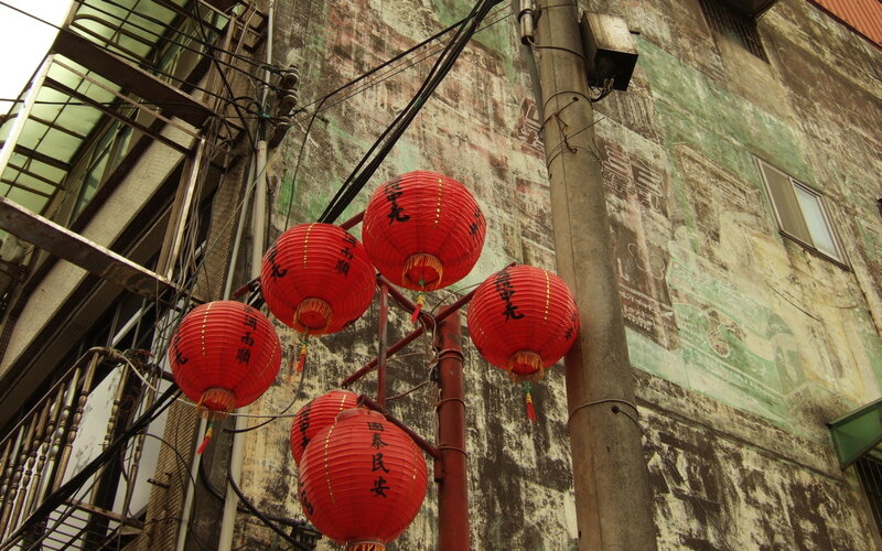 Red lanterns in an old alley
