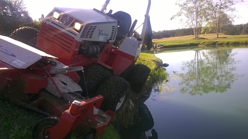 Red Lawn Tractor in Pond