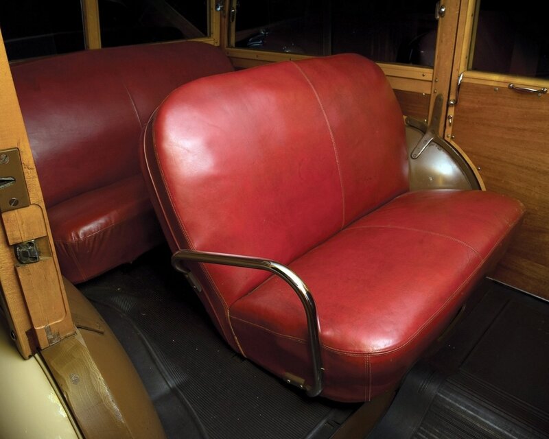 Red leather seats in vintage vehicle