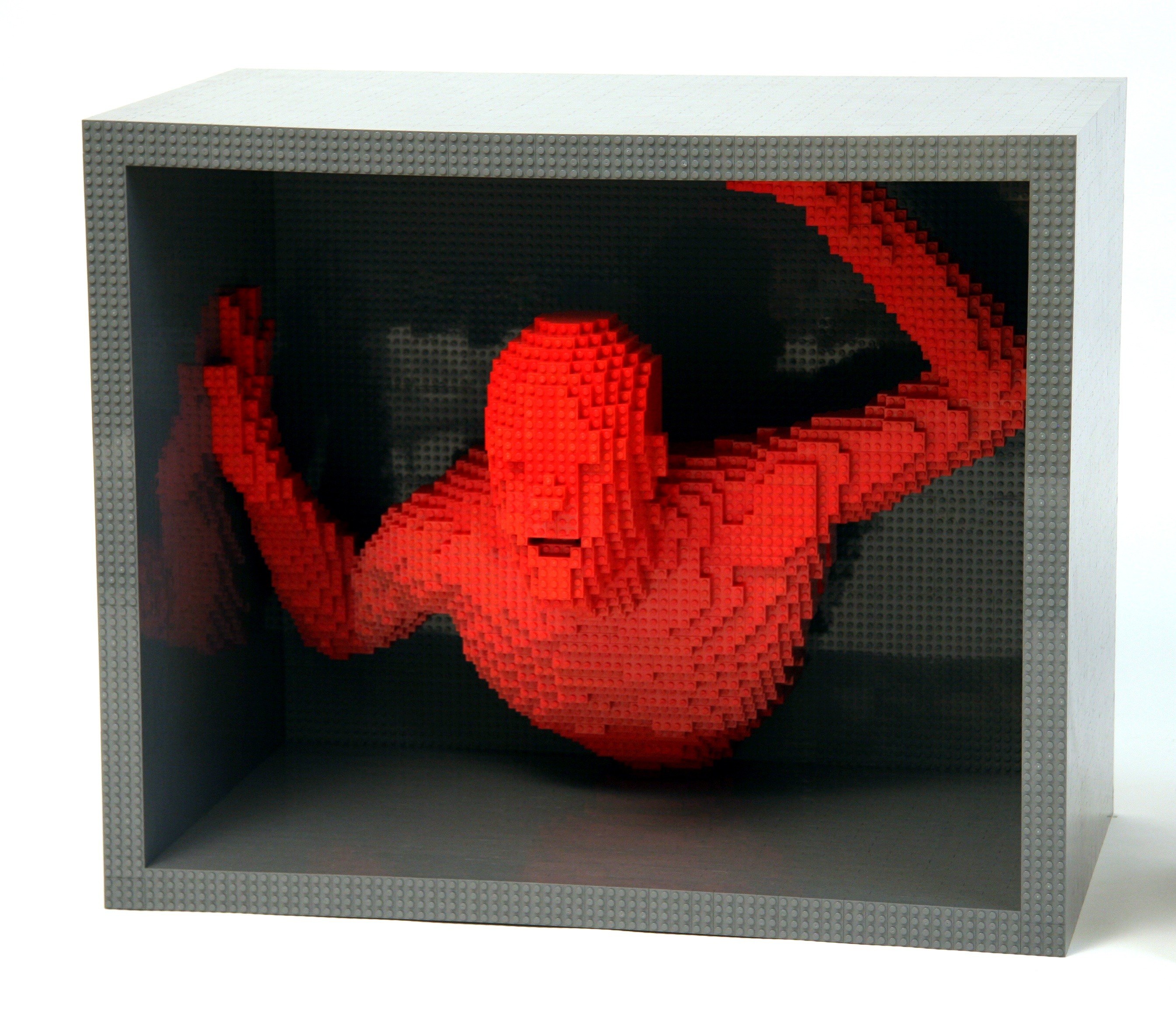 Red Lego figure in display box